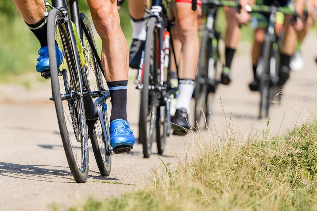 group of cyclists on road bikes